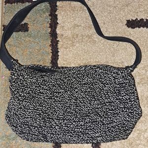 Ladies small black and white one pocket purse, black strap.